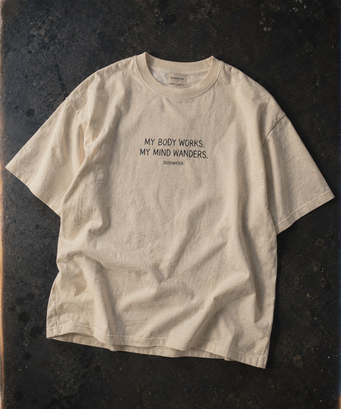 DUSKWATER My Body Works oversized graphic tee in washed ivory — cinematic American streetwear