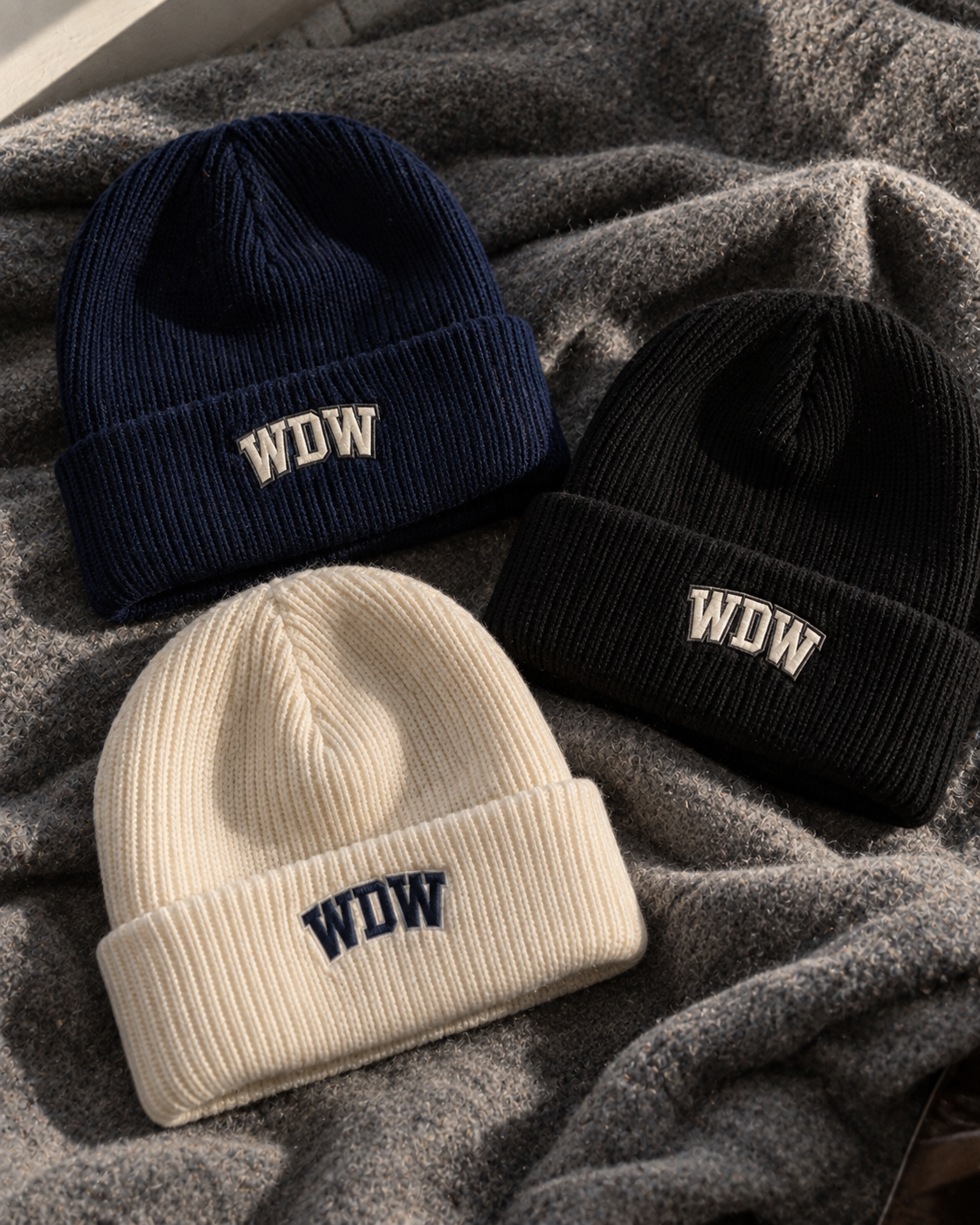 Embroidered WDW cuffed beanies in navy, black and cream